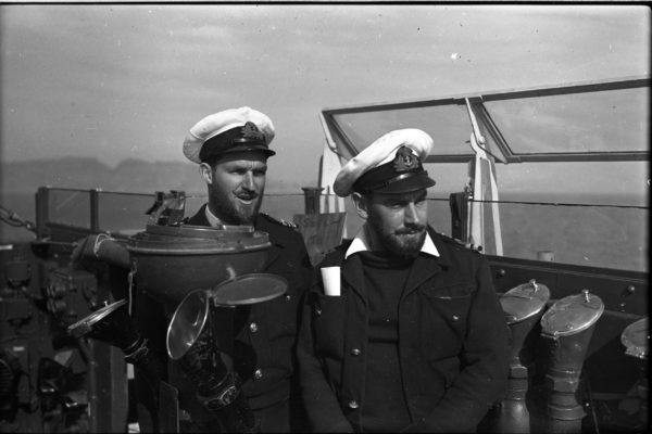 LT CDR R T Hale left, and LT Peter Silk right, in Korean waters on the bridge of HMNZS Taupo - members of the 'Whiskers Club' a group of crew members who had committed to growing beards whilst in Korea 1951/52