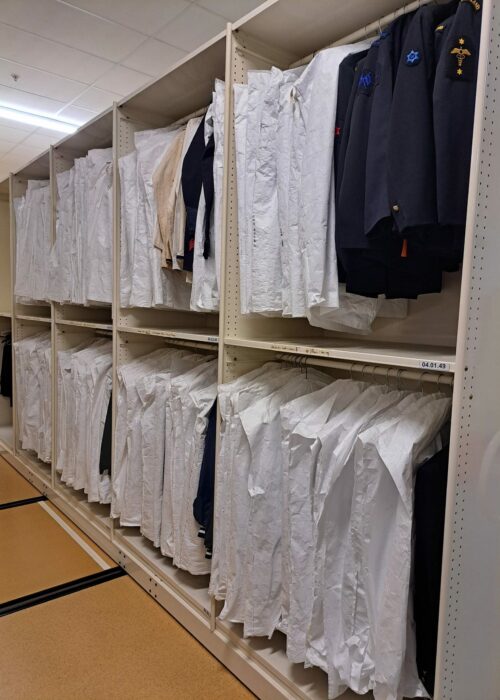 20241118_085251 The old hanging storage - cramped, dusty, disorganised and inconsistently labelled.