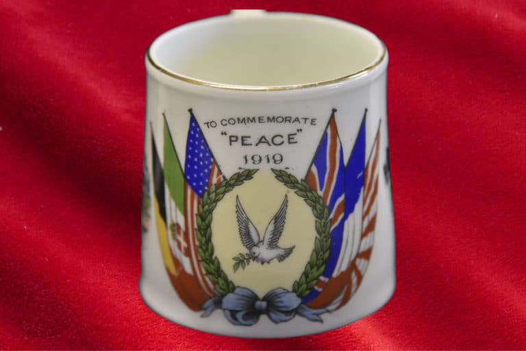 Small china cup commemorating declaration of Peace on 28 June 1919 when the Treaty of Versailles was signed, setting the peace terms for the defeated Central Powers: Germany, Austria-Hungary, the Ottoman Empire and Bulgaria. The Armistice signed the previous year on 11 November 1918, did not mark the official end of the war; as the terms of peace had not yet been signed. The cup is part of the Museum's Education handling collection.