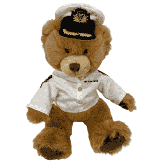 Teddy bear in white officer navy uniform